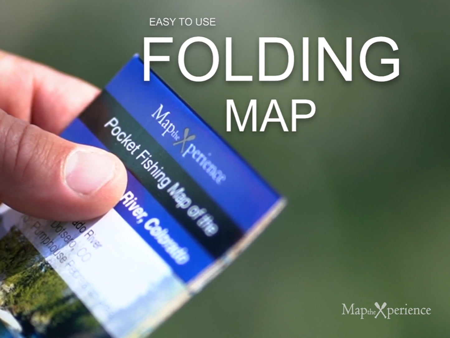 "Easily navigable pocket-sized folding map for outdoor activities, highlighted by a hand demonstrating its user-friendly design. Ideal for fishing enthusiasts."